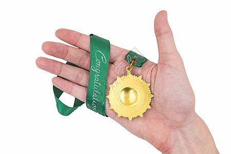 手握金奖章 白底带绿丝带白色冠军竞技运动花圈奖牌得主青铜证书成功图片