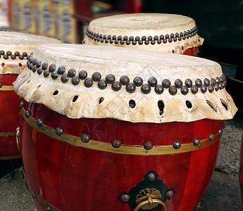 中国大鼓传统振动韵律遗产黄铜戒指大头钉乐器音乐圆柱背景图片