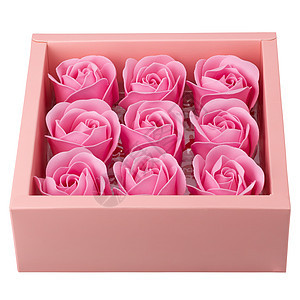 粉红色的玫瑰花 在粉红色的盒子里 与白色背景隔绝图片