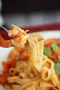 海鲜意大利面加番茄酱香料叶子蔬菜食物香菜面条美食餐厅传统草本植物图片
