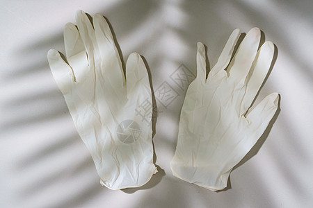 一对白乳胶的医用手套外科临床塑料保健预防工作手指安全橡皮医生图片