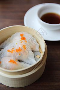 竹篮中中国菜糊食物点心白色盘子水饺猪肉美食餐厅竹子午餐图片
