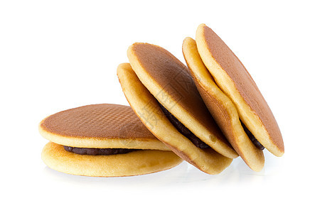 Dorayaki 日式日本小吃 Dorayaki 是日本的意大利面包糖果营养红色蛋糕传统饼子白色食物圆圈棕色图片