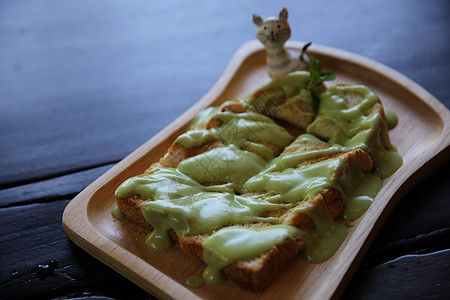 泰国甜食 绿色的奶油烤面包蒸汽午餐盘子甜点早餐食物叶子文化小吃牛奶图片