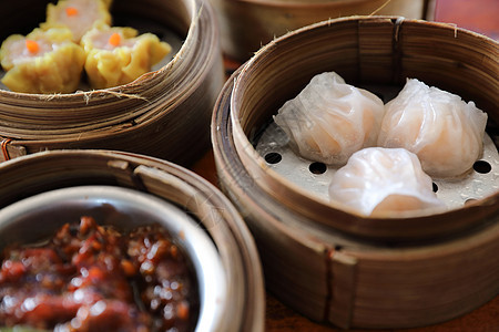 Dim sum 蒸汽在木篮子中国食品中排挤食物包子饺子午餐烹饪小吃水饺餐厅美食饮茶图片