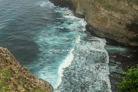 概述全景海洋海岸 悬崖 日落 巴厘岛 印度洋上空的鲜花和绿顶垂直悬崖令人不知所措 巴厘岛南部 寺 印度尼西亚热带旅行阳光天空石头图片