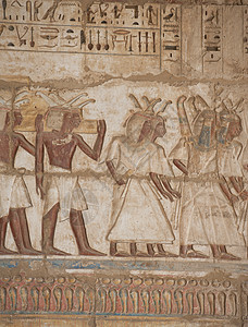 雕刻墙寺庙墙上的埃及象形文字石头吸引力旅行雕刻绘画法老写作景点崇拜游客背景