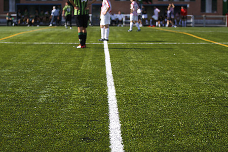 足球场的线条运动足球绿色运动员球员背景图片