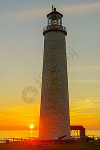 太阳升起在灯塔海湾蔷薇海岸旅行建筑学导航半岛海洋地标海景图片