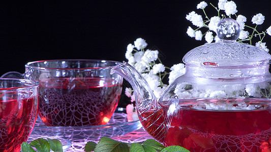红茶泥加康乃馨花 Zen茶仪式 恩格里斯绿叶植物花草排毒传统场景茶具绿茶瓶子琥珀色图片