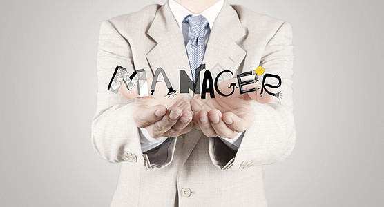 商务人士手把设计用图形字“MANAGER”作为概念高清图片