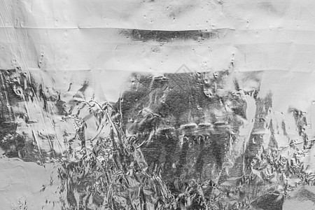 被弄皱的铝制厨房箔的质地 银色抽象背景材料反射金属白色皱纹黑色合金艺术空白工业背景图片