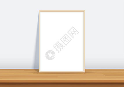 木桌上有海报模型的框架艺术横幅空白广告白色木头办公室文件夹木板小样图片