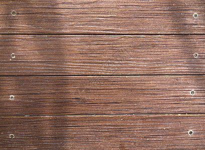 棕色木质抽象表面 背面有螺丝控制板木头作坊墙纸木工硬木粮食木材桌子地面图片