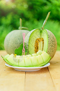木板上的新青绿瓜黄色水果场地热带植物蔬菜饮食白色甜瓜西瓜图片