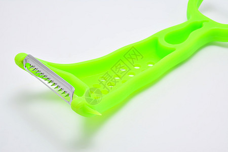 绿色剥皮机加磨草机厨房工具牙齿食物塑料绿色材料金属皮肤不锈钢图片