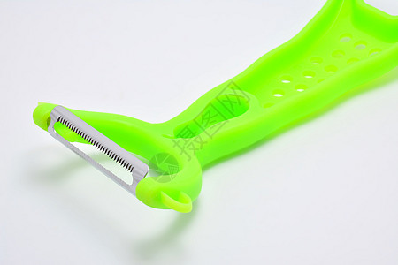 绿色剥皮机加磨草机厨房工具金属绿色塑料食物不锈钢材料皮肤牙齿图片