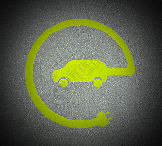 EV  电动车辆充电站标志 沥青纹理上的E标志叶子化石生态电力杂交种石油运输电气插头车站图片