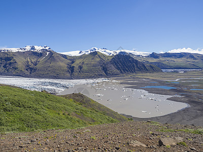 冰岛斯卡夫塔山国家公园的冰川泻湖 斯卡夫塔山冰山和冰舌 瓦特纳冰川支线 莫萨尔达卢河谷和五颜六色的流纹岩山远足冰山旅行游客国家岩图片