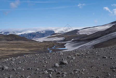 冰川和火山 熔岩灰 来自融雪和冰的蓝流 冰岛 夏蓝天空苔藓冰盖猪肉自然溪流雷神岩石旅游高地远足图片