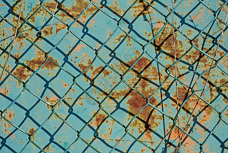 有蓝色 生锈背景的栅栏监狱障碍工业镀锌网格墙纸安全风化床单设计图片