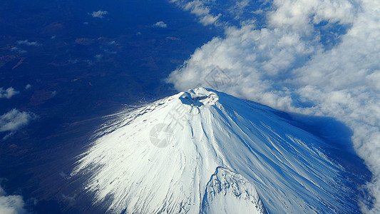 藤山山和白雪的顶角飞机旅行蓝色火山天空顶峰地标公吨风景鸽子图片