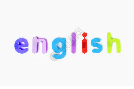 在白背景上拼写 英文 的字母表磁铁影棚幼儿园语言童年对象塑料文本特写静物玩具图片