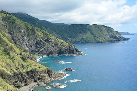 山观白沙滩度假胜地的岩石形成和海水形成波浪编队海洋旅游海滩极光蓝色场景旅行风景图片