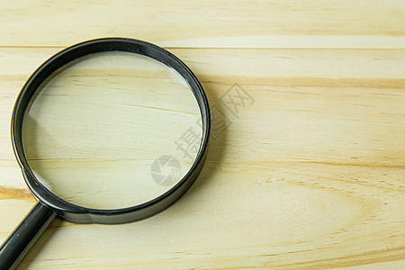 a 木本底图象上的放大镜手表光学镜片调查白色木头金属插图检查黑色图片