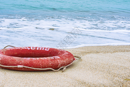 海滩上的生命之宝浮标救援生存海景储蓄者安全圆圈冲浪救生圈情况图片