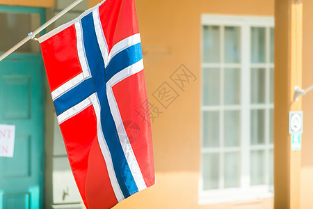 挪威特隆海姆建筑墙上的旗帜国家蓝色旅游旅行红色白色织物城市图片