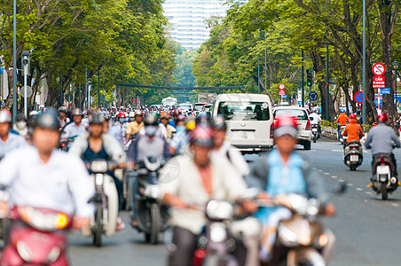 越南胡志明市繁忙的街道交通骑士城市人群驾驶摩托车旅行自行车噪音车辆图片