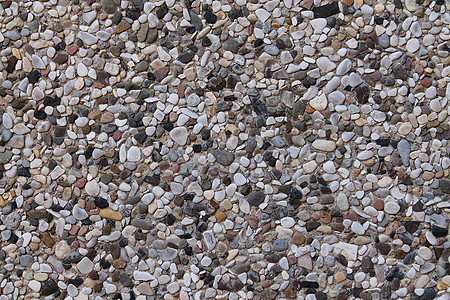 详细近视碎石和石块的碎石地花岗岩鹅卵石白色纹理食物种子建造灰色大理石岩石图片