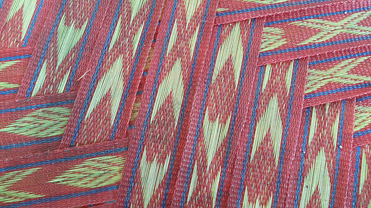 彩色塑料编织条纹的特写视图地毯图案工艺夏派柳条墙纸假寐文化寝具材料图片