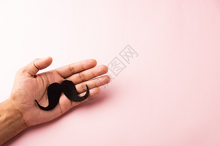 男人用手握黑胡子的活动前列腺手势蓝色拇指手指调色男性癌症身体背景图片