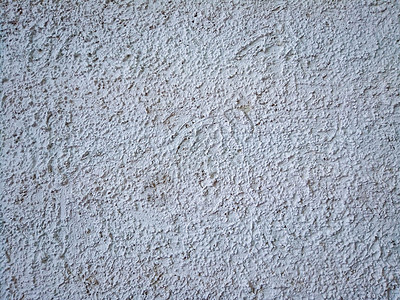 水泥石膏皮草大衣 墙上的街道石膏 纹理 大凸起 白色空背景 建筑立面的修整背景图片