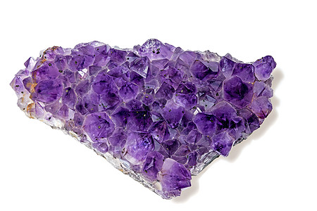 紫水晶珠宝石英矿物紫色宝石宏观反射石疗紫丁香装饰品背景图片