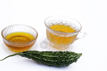 白色分离的流行排毒凉茶 即与蜂蜜及其成分分离的苦瓜或苦黄瓜茶杯子柠檬绅士饮料饮食薄荷黄瓜葫芦苦瓜子香脂图片