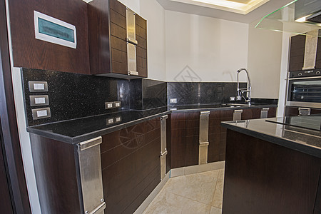 豪华公寓的现代厨房设计图房间奢华工作台房子不锈钢展示厅抽屉橱柜金属龙头图片