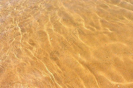 反映沙沙沙滩底部纹理的水浪的波纹晴天热带海洋海滩运动海浪海岸支撑折射火花图片