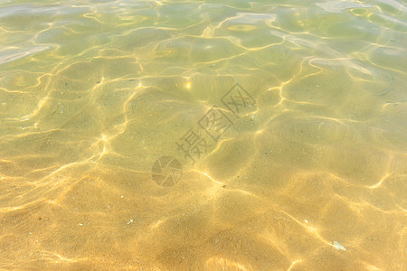 反映沙沙沙滩底部纹理的水浪的波纹液体场景火花涟漪海滩海浪海岸反思热带阳光图片