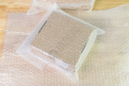 保护产品用气泡膜覆盖盒子的气泡舰队服务白色软垫压力缓冲商品材料安全包装图片