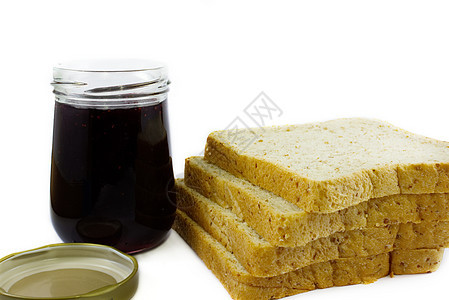 整个小麦面包堆和葡萄酱 在孤立的白色背景玻璃甜点面包美食盘子营养小吃午餐烹饪食物图片