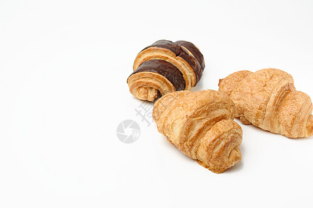 白底白面面粉制成的烤巧克力牛角面包早餐面团食物营养棕色脆皮包子糕点白色工作室图片