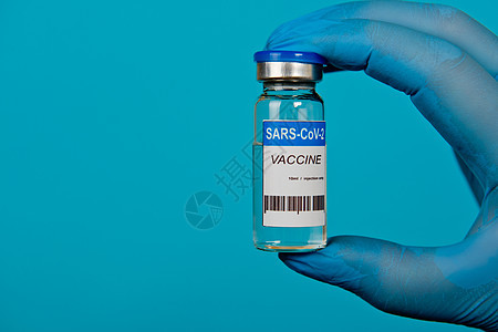 用蓝手套手握着Covid19冠状病毒疫苗的小瓶技术药店医生医疗玻璃液体疾病实验室医院生物图片