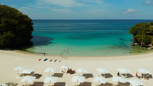 热带海滩和蓝色环礁湖旅行海景太阳床珊瑚礁珊瑚酒店理念海湾海岸线假期图片