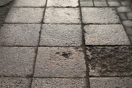 石头铺路纹理地面街道反思正方形岩石阳光材料旅行人行道鹅卵石图片