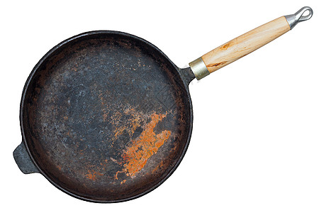 在白色背景上隔离的锈铁铸铁锅油炸用具投掷食物小路工具乡村炊具烹饪厨房图片