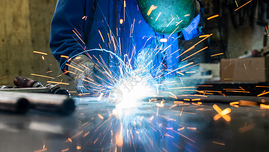 焊接金属焊接器宏观制造业机械工人焊机锁匠蓝色劳动经验生产背景图片