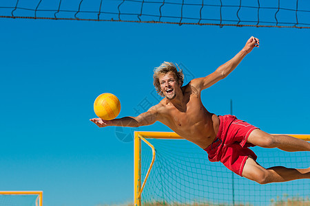 海滩排球  男人跳跃运动员运动娱乐天空防御闲暇保卫活力球赛竞赛图片